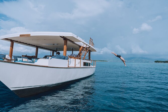 4-in-1 • Gili Islands Half-day Snorkel & Lunch Catamaran Tour - Snorkel stops built around underwater statues, Turtle City, and Secret Garden