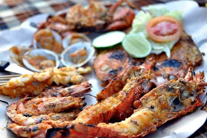 Best Romantic Seafood Dinner at Jimbaran Beach Sunset - Meeting at Kekeluargaan Pandan Sari Cafe and What to Expect
