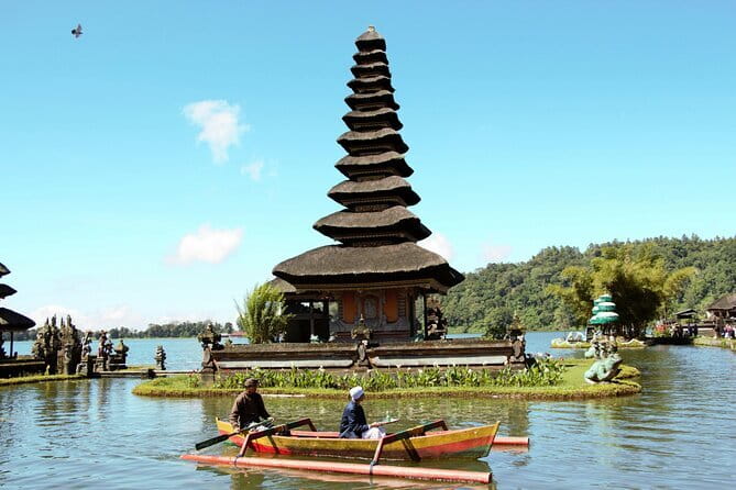 Full Day Bedugul and Tanah Lot Tour - Most Scenic Site - Stop 2: Handara Iconic Gate, Bali architecture with a mountain backdrop