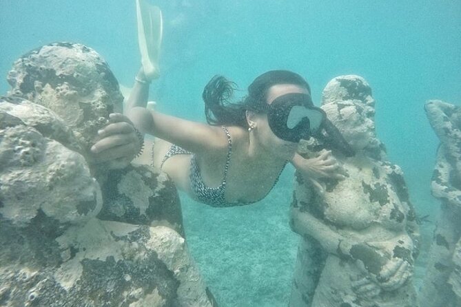 Gili island Snorkeling Half Day Trip departure from Gili Trawangan - Stop 1: Gili Meno Beach, turtles, and the Nest sculpture you can almost touch