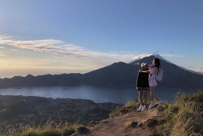 Sharing Mount Batur Sunrise Trekking Guide Pick Up and Drop Off - The Climb to Mount Batur: Pace, Safety, and Slippery Footing