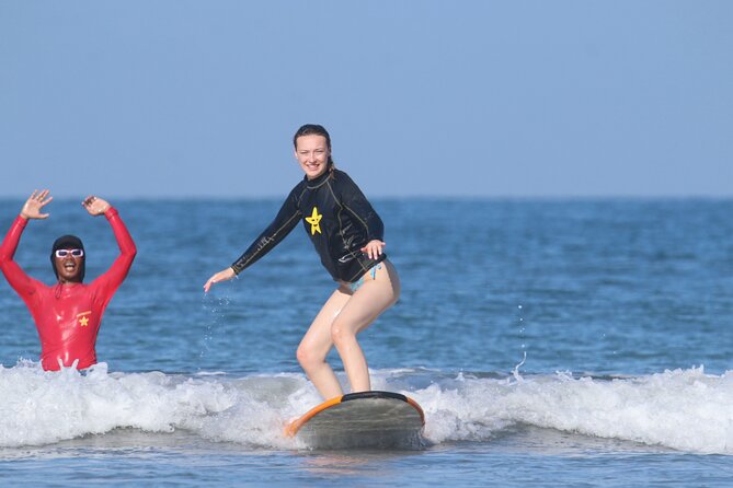 Surf Lesson with a Personal Instructor at Kuta Beach - In the water on beginner gear, paddling, standing, and catching your first ride
